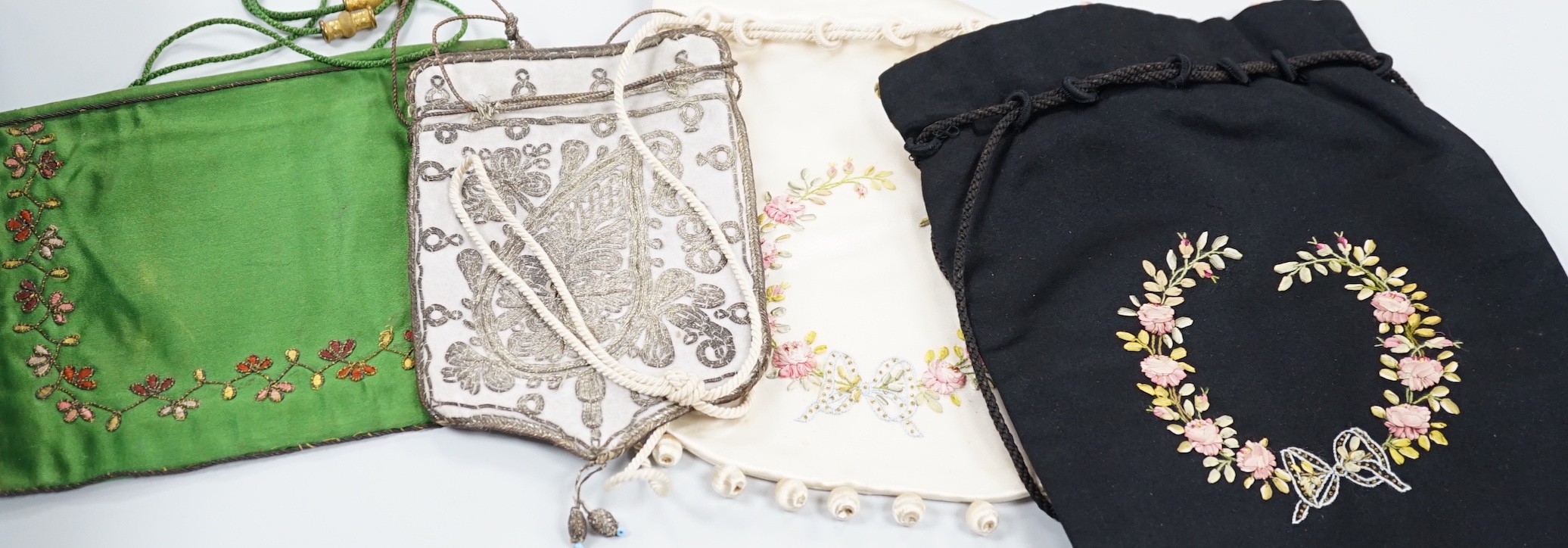 An Indian metal thread embroidered table cover and a collection of crochet, woven and embroidered bags, some with ribbon-work and cut steel and seed decoration